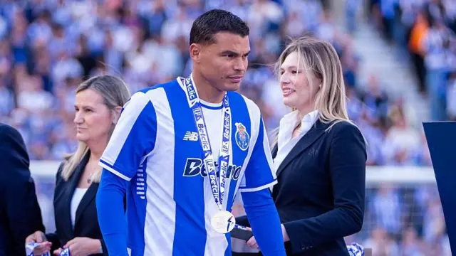 Thiago Silva receives his medal having won the Portuguese league