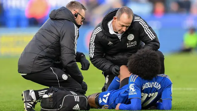 Hamza Choudhury of Leicester City receives medical attention during the Championship match against Charlton Athletic