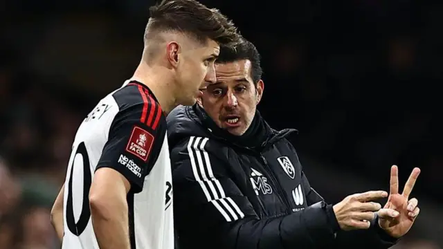 Tom Cairney gets instructions from Marco Silva