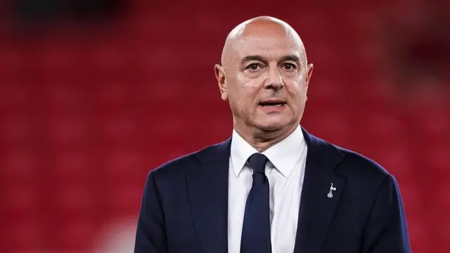 Daniel Levy looks on