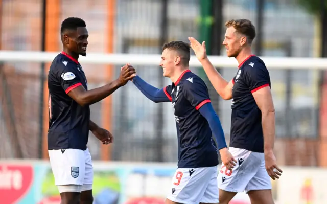 Ronan Hale is congratulated by teammates after his goal for Ross County