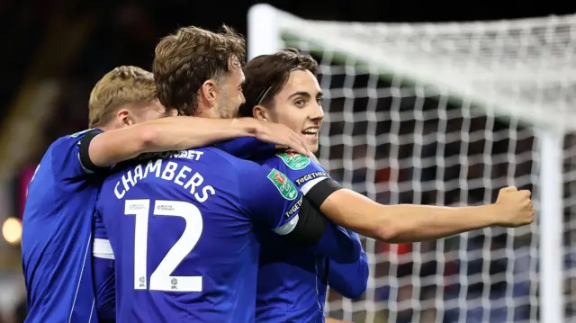 Cardiff players celebrate Joel Colwill's goal at Burnley