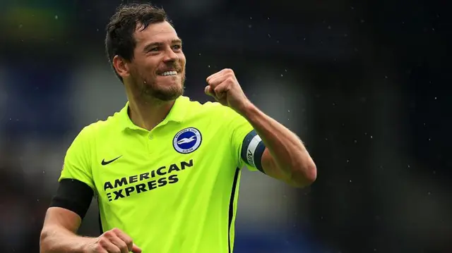 Gordon Greer celebrates for Brighton