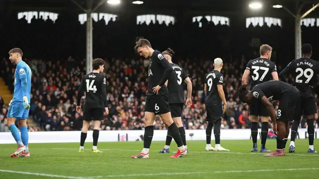 Tottenham players look dejected after conceding against Fulham