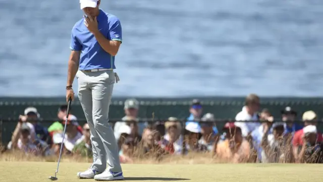 Rory McIlory misses a putt on the green