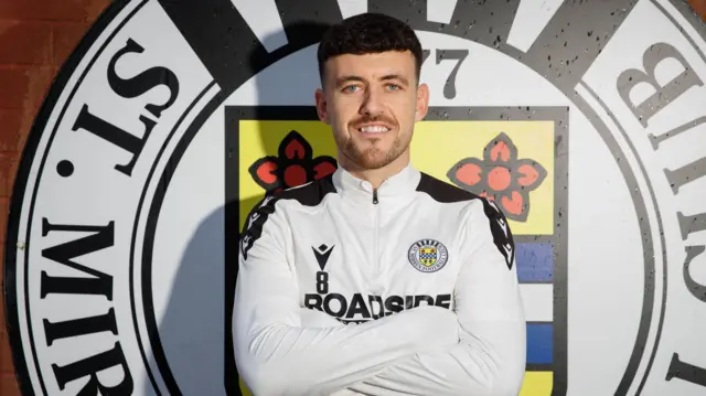 Oisin Smyth poses for photos at St Mirren's training ground