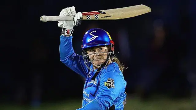Tammy Beaumont raises her bat for her half-century