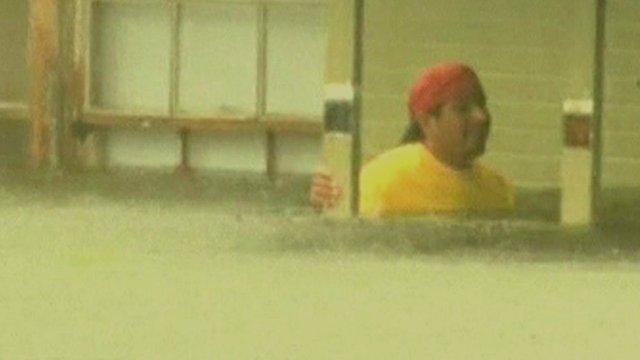 Man in flood water outside Louisiana home