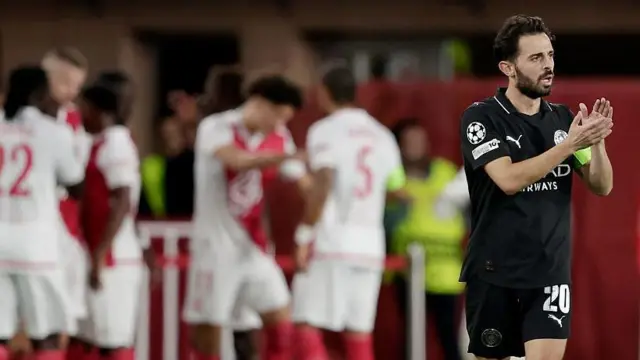 Bernardo Silva looks disappointed as Monaco players celebrate