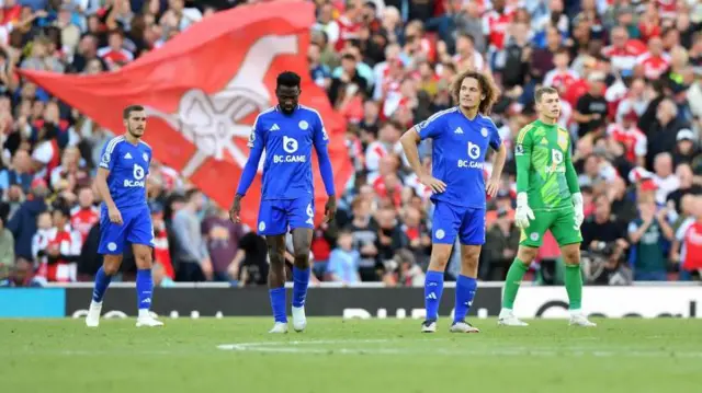 Leicester players react after conceding in the Foxes' Premier League defeat to Arsenal