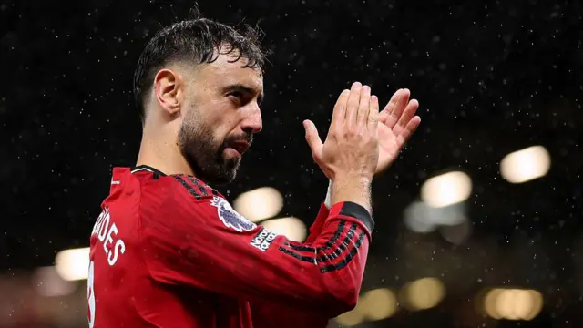 Bruno Fernandes applauds the Manchester United fans