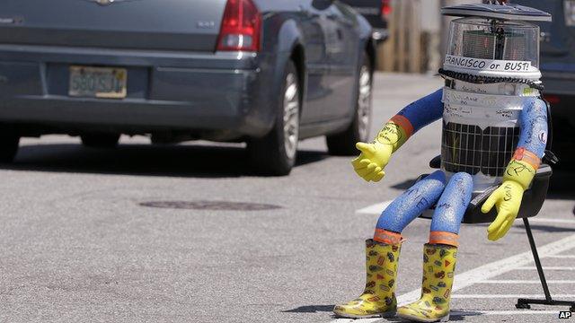 File picture of robot, HitchBOT, thumbing a lift in Marblehead, Massachusetts