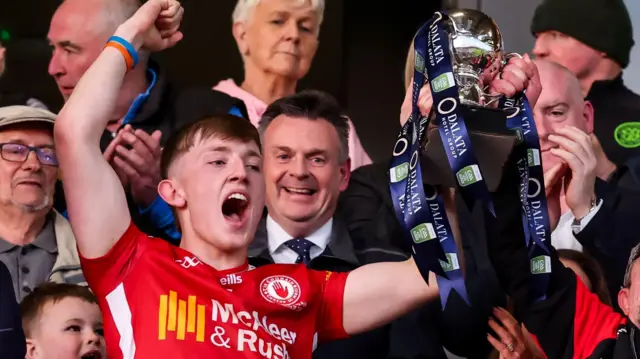 Conor Devlin lifts the cup