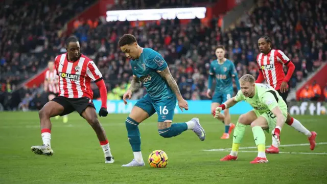 Marcus Tavernier is challenged by Joe Aribo and Aaron Ramsdale