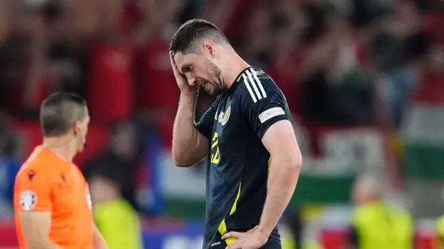 Scott McKenna looking dejected after Scotland's defeat to Hungary