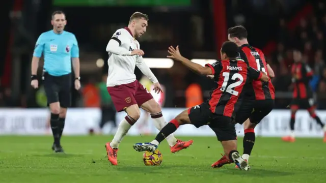 Tyler Adams tackles Jarrod Bowen