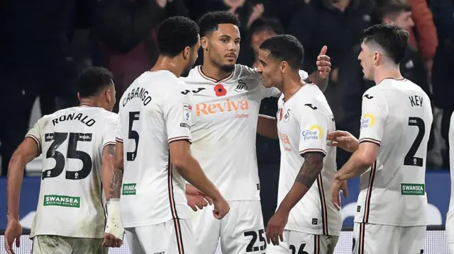 Swansea players celebrate Myles Peart-Harris' goal