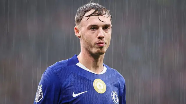 Cole Palmer looks on for Chelsea in the rain