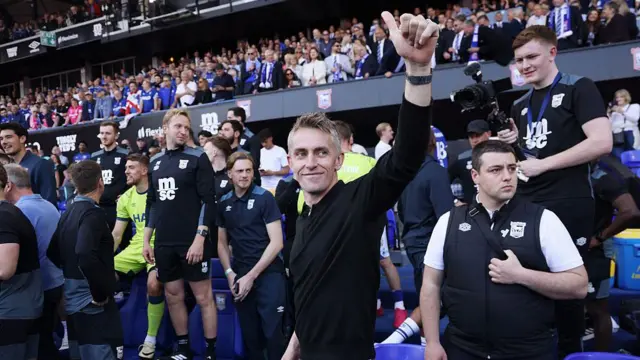 Kieran McKenna waves to crowd