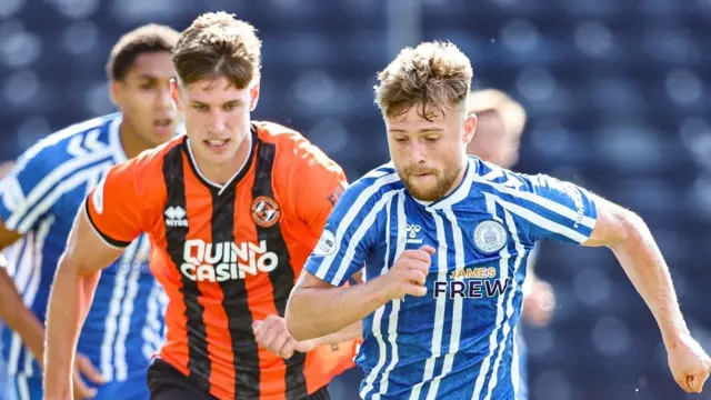 Dundee United's Krisztian Keresztes and Kilmarnock's David Watson