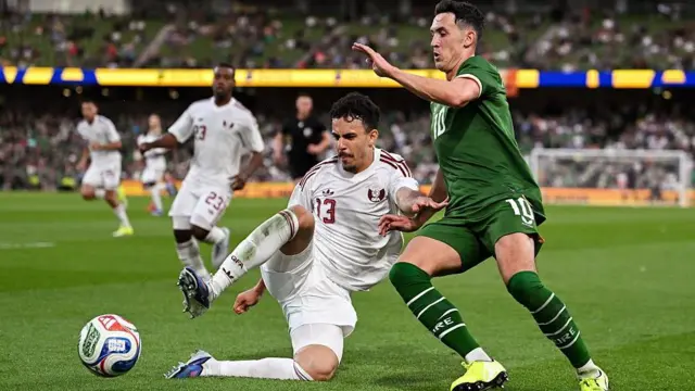 Assim Madibo of Qatar in action against Jamie McGrath of Republic of Ireland 