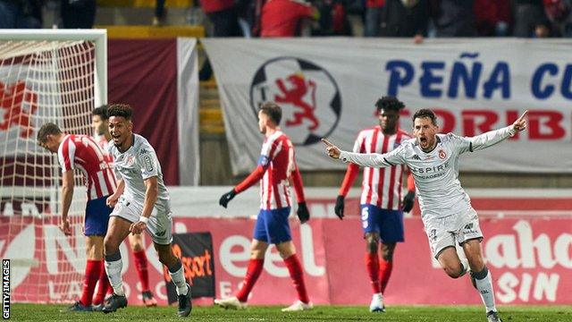 Atletico Madrid players react to the defeat