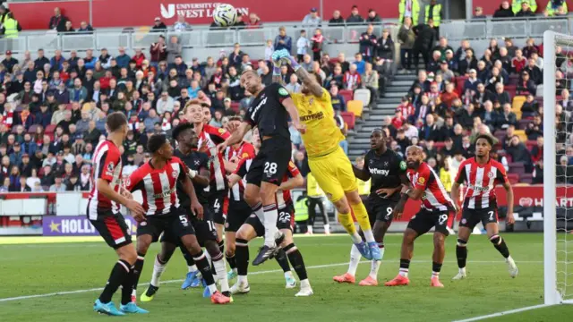 Brentford's Mark Flekken punches clear from West Ham United's Tomas Soucek during the Premier League match between Brentford FC and West Ham United FC at Brentford Community Stadium