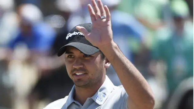 Jason Day waves