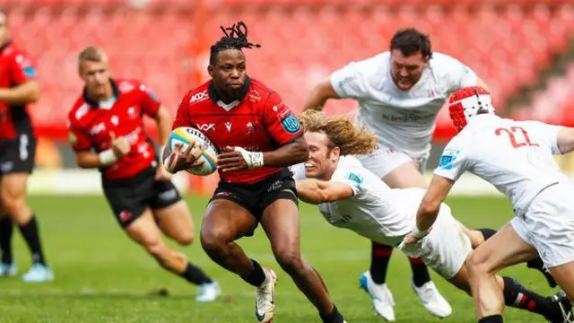 Werner Kok attempts to make a tackle