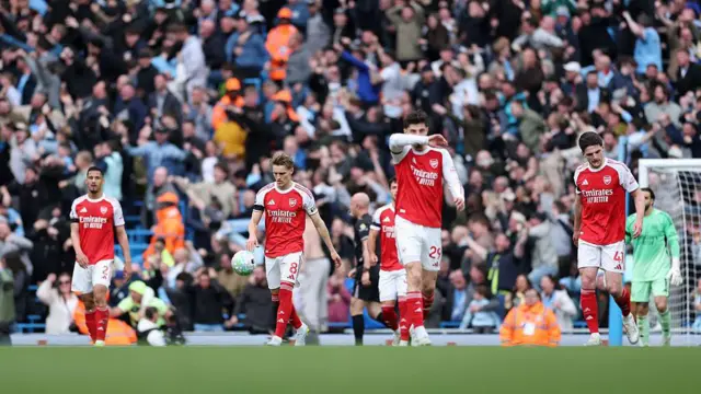 Arsenal players look dejected