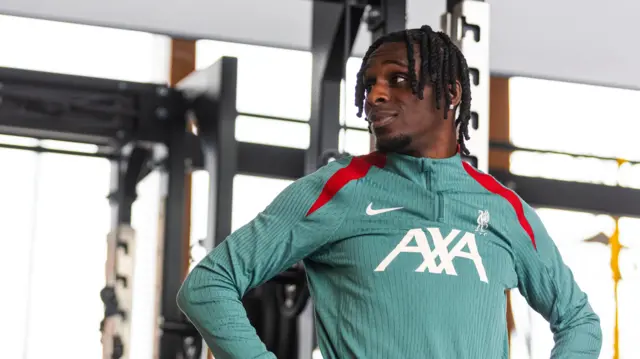 Jeremie Frimpong looks on from Liverpool training centre