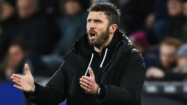 Middlesbrough boss Michael Carrick gesturing from the touchline.