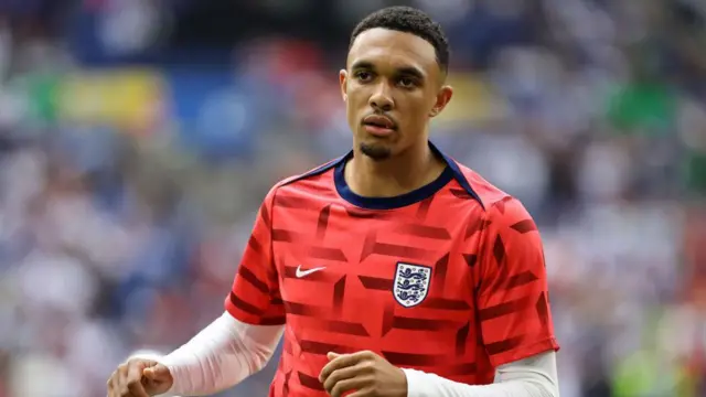 Trent Alexander-Arnold warms up for England