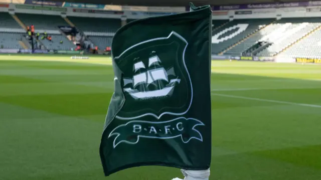 Plymouth Argyle's club badge on a corner flag at Home Park.