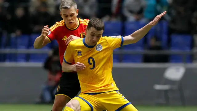 Belgium's Leandro Trossard and Kazakhstan's Islam Chesnokov 
