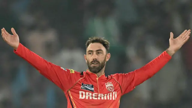 Punjab Kings all-rounder Glenn Maxwell with his arms raised in celebration