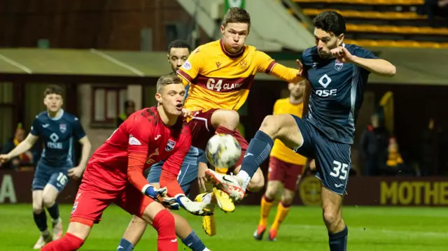 Ross County's George Wickens and Will Nightingale and Motherwell's Blair Spittal in action during a cinch Premiership match between Motherwell and Ross County at Fir Park