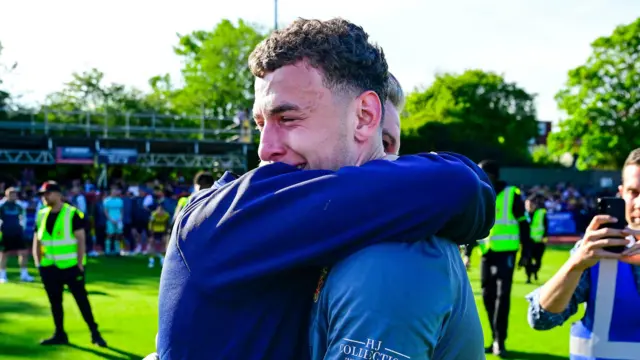 Arthur Nasta (right) hugs Hornchurch manager Daryl McMahon