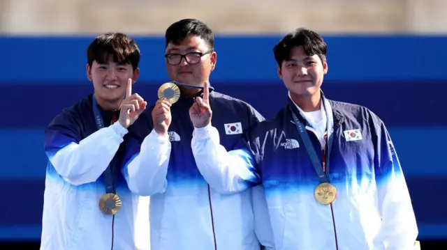 South Korea's Je Deok Kim, Woojin Kim and Wooseok Lee 