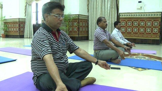 Men doing yoga