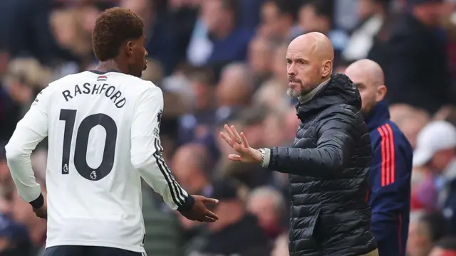 Marcus Rashford and Erik ten Hag speak on the touchline