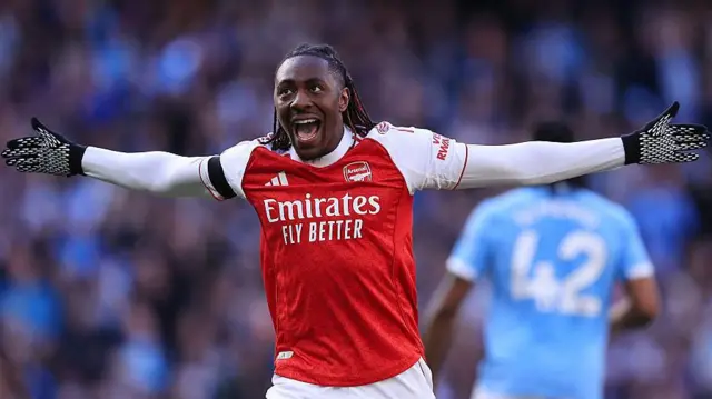 Eberechi Eze stands arms wide