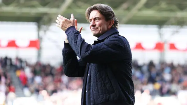 Thomas Frank, Manager of Brentford, applauds the fans