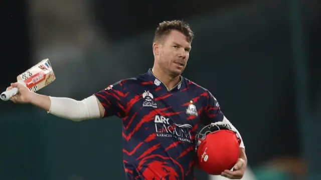 David Warner raises his bat in the PSL