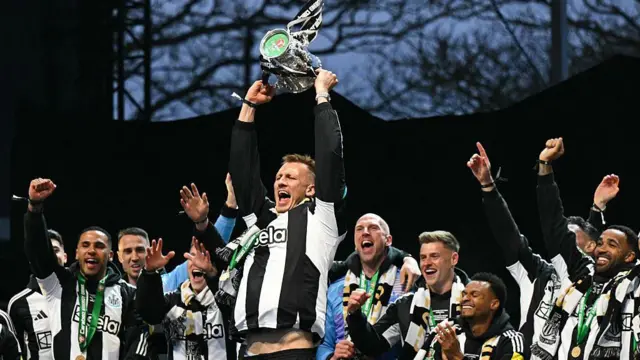 Dan Burn lifting the Carabao Cup