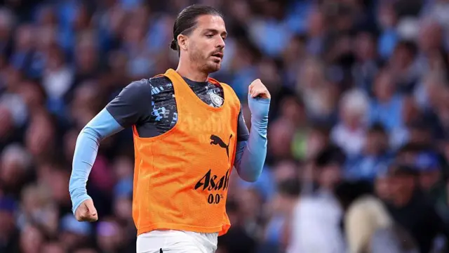 Jack Grealish warming up for Manchester City