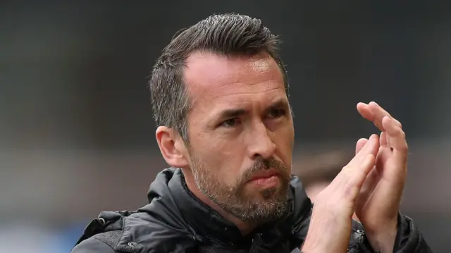 Newport County boss Christian Fuchs applauding fans