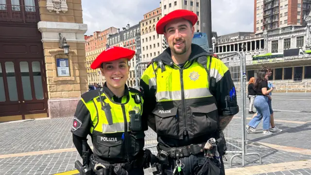 Two police officers pose for a picture