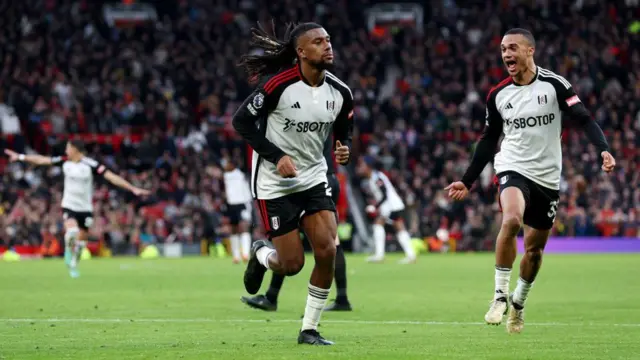 Alex Iwobi of Fulham celebrates scoring his team's second goal