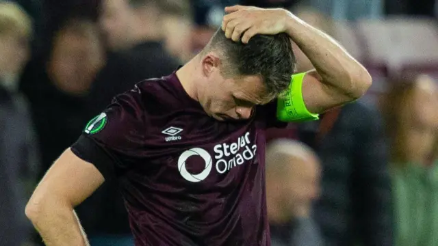 Hearts' Lawrence Shankland looks dejected as Heidenheim's Jan Schoppner scores to make it 2-0 during a UEFA Conference League 2024/25 League Phase MD3 match between Heart of Midlothian and Heidenheim at Tynecastle Park